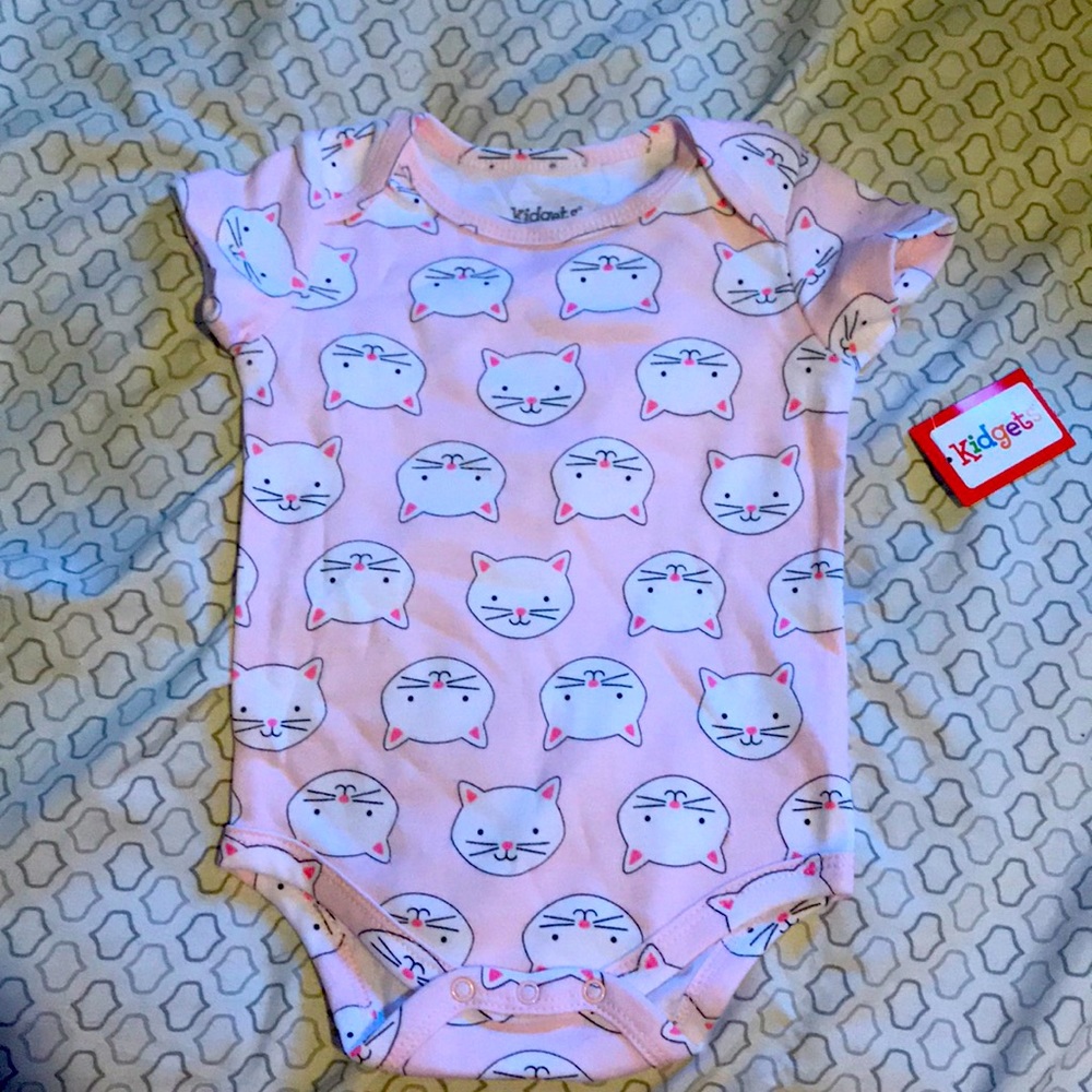 Pink body suit with cat heads